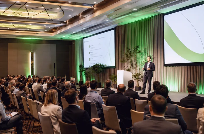 Conference presentation with audience